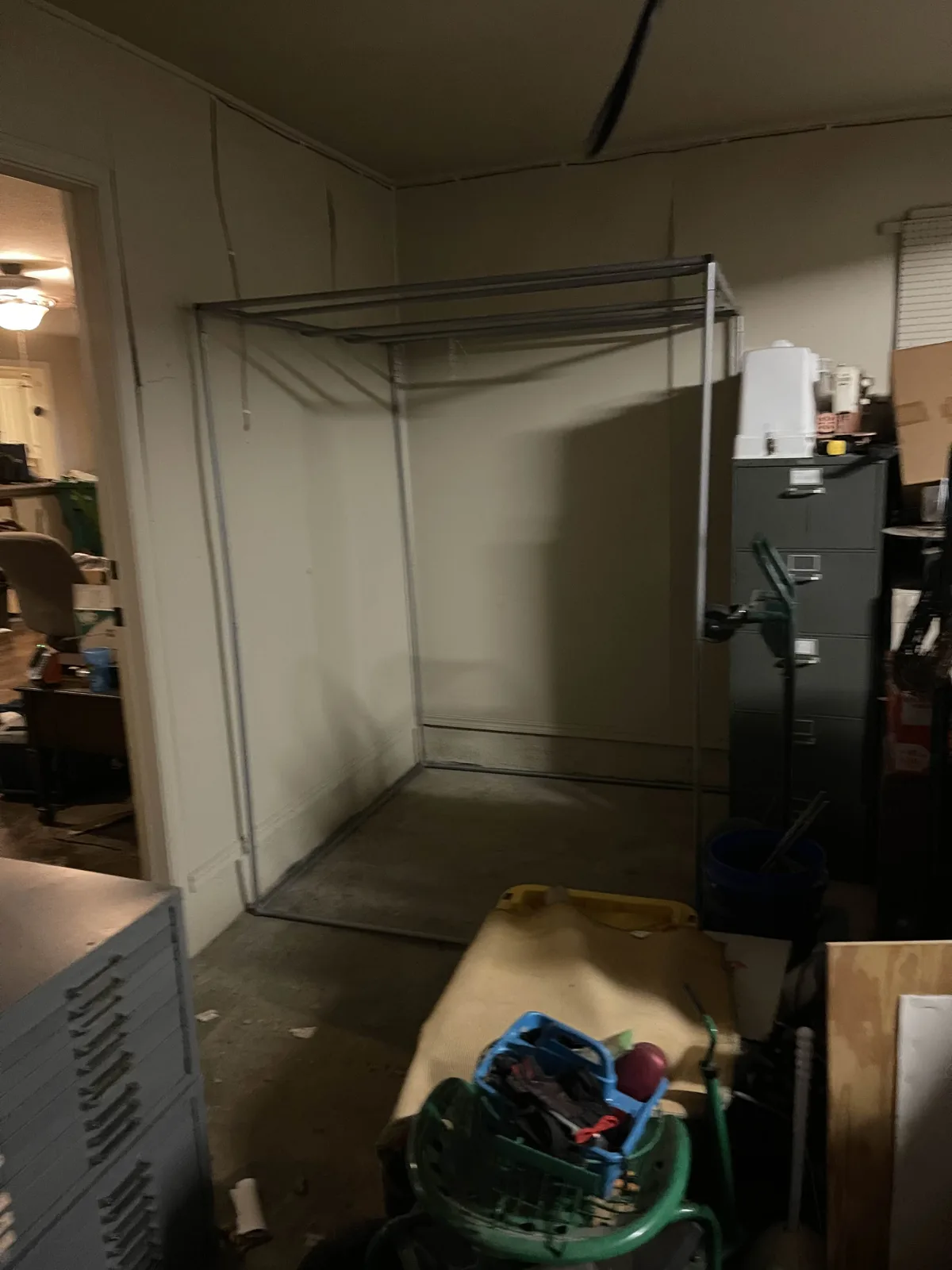 The bare tent frame in its garage spot.